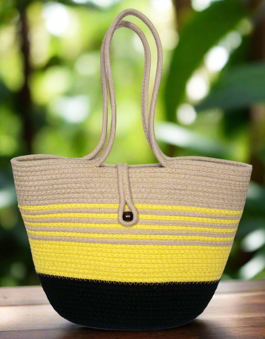Eco-friendly beige, yellow, and black cotton tote bag with rope handles