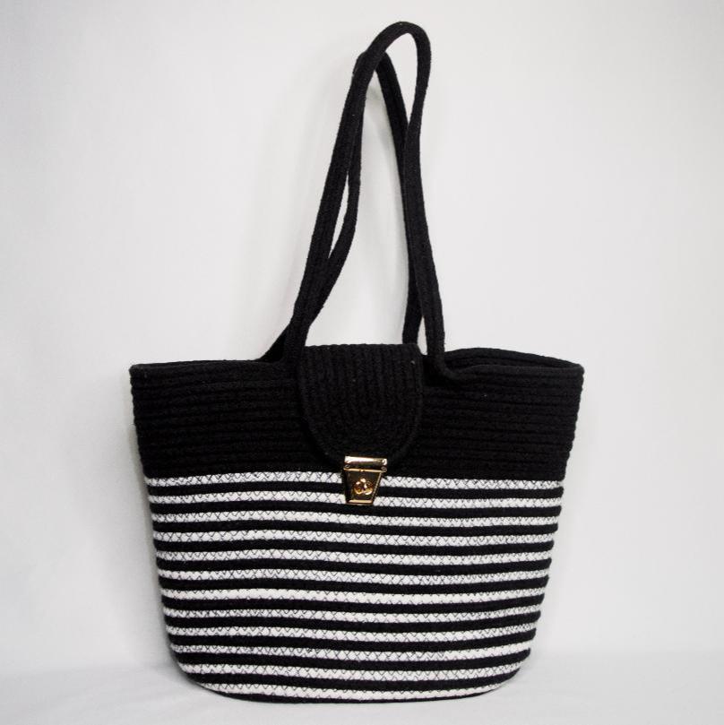 Modern handwoven black and white cotton tote bag with clasp closure