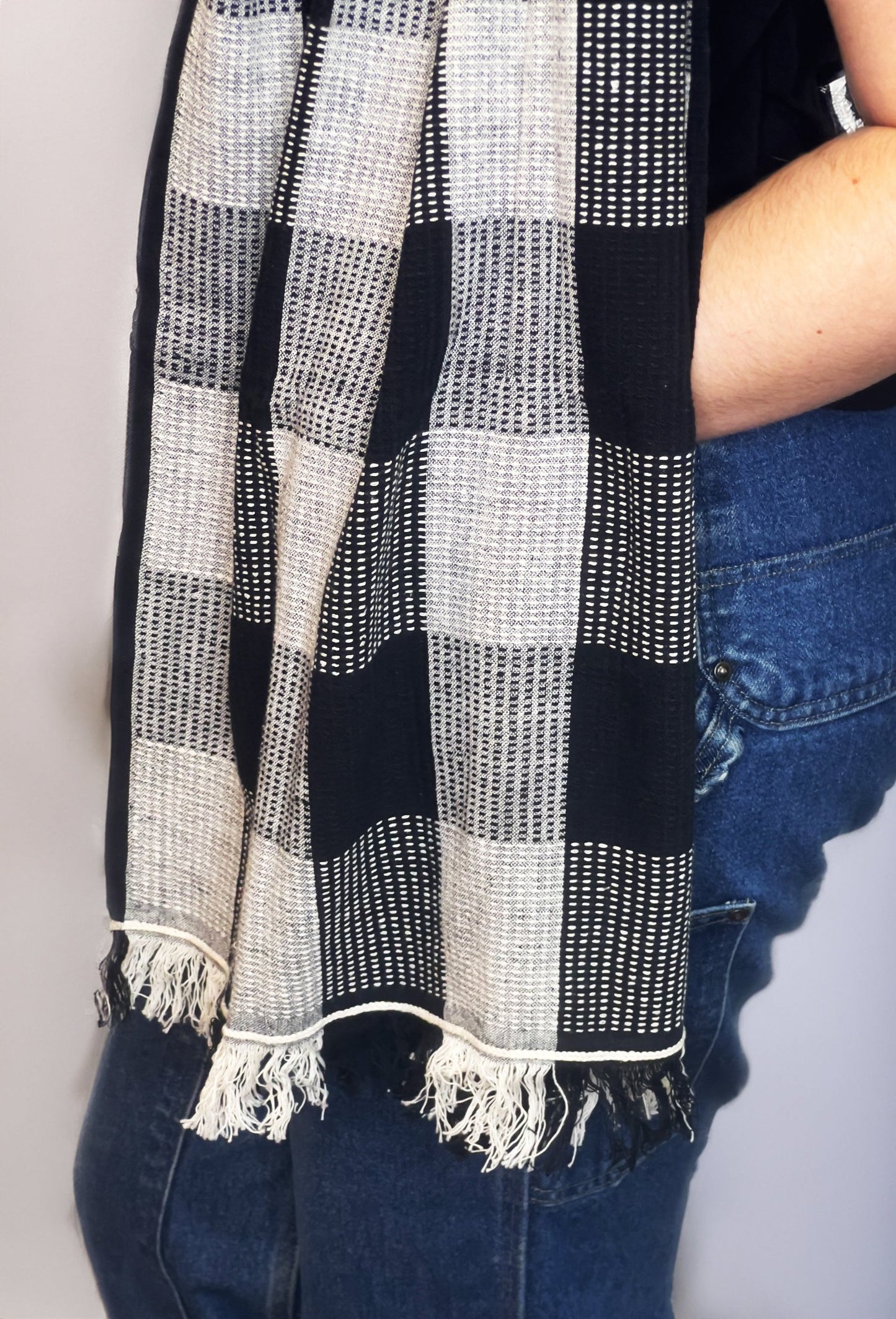black and white scarf styled around a mannequin's neck