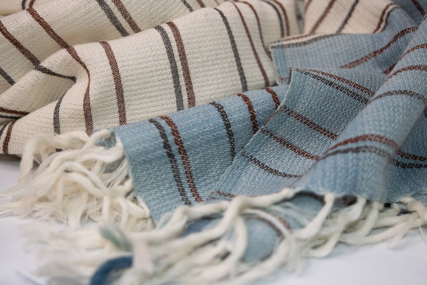 wool scarf with blue and cream stripes and fringed edges