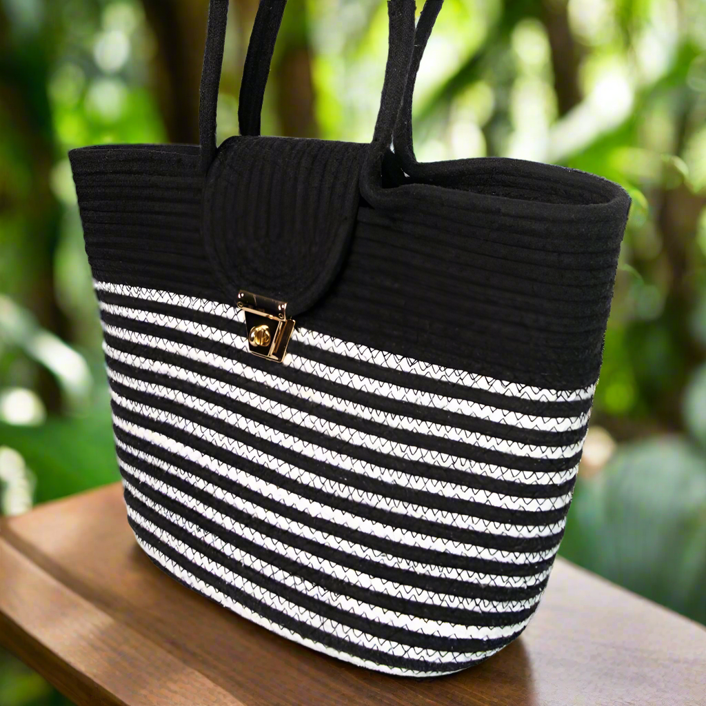 Black and white handwoven cotton tote bag with metal clasp