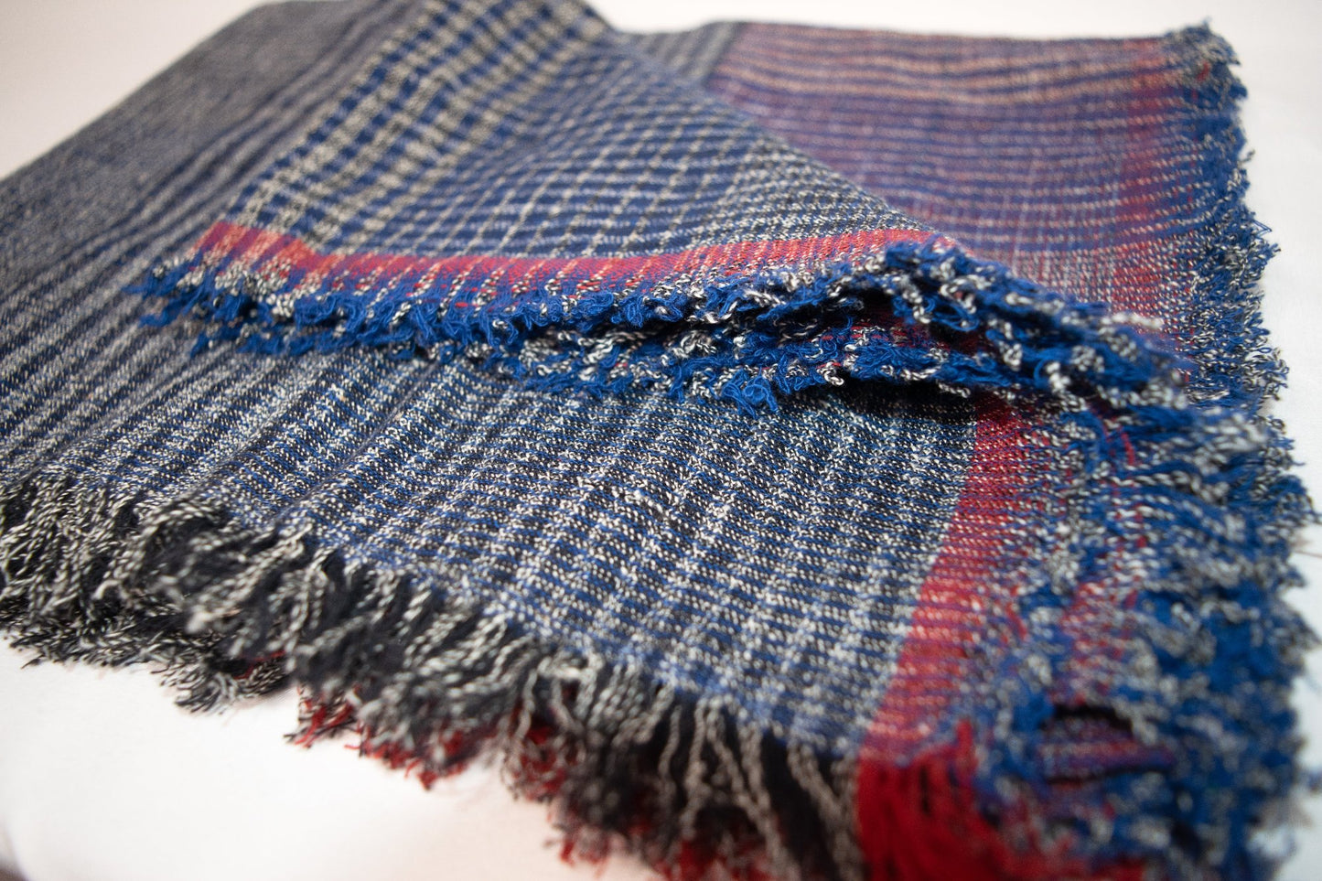 Casual black & blue plaid scarf with red accents for winter wear