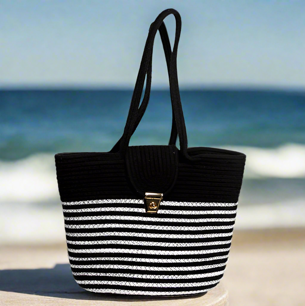 Stylish black and white cotton tote with handwoven design and secure metal clasp