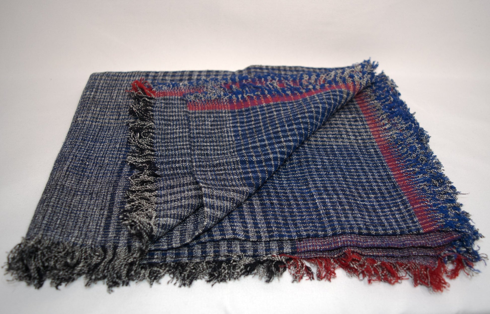 Stylish plaid cotton wrap in black, blue, and red tones